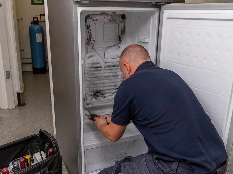 Freezer repair technician in a Dubai home