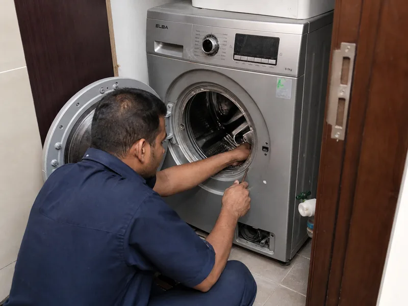 Technician repairing washing machine in Dubai